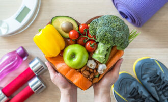 Healthy lifestyle on ketogenic diet, eating clean keto food good health dietary in heart dish with aerobic body exercise, gym workout training class , weight scale and sports shoes in fitness center